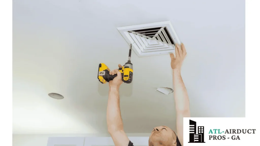 Airductcleaning-ATL.com team professional in Atlanta cleaning top ceiling duct for healthier air and efficient ventilation.